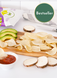 Bestseller Cutting board with Artisan Tropic's 4.5 oz Sea Salt Cassava Strips, sliced avocados and red salsa